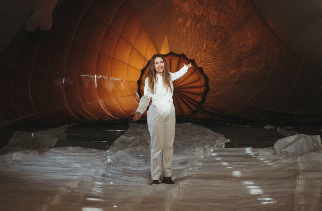 Artist Patricia Piccinini stands inside Skywhalepapa as it begins to inflate at John Dunmore Lang Place on February 7, 2021. Picture by Dion Georgopoulos