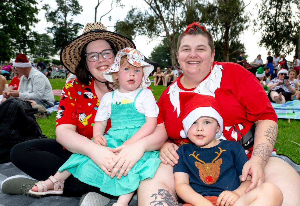 Charlotte, Sailor, 2, Hayley and George Fitzpatrick, 4, of Casey at Carols by Candlelight at Stage 88. Picture by Elesa Kurtz