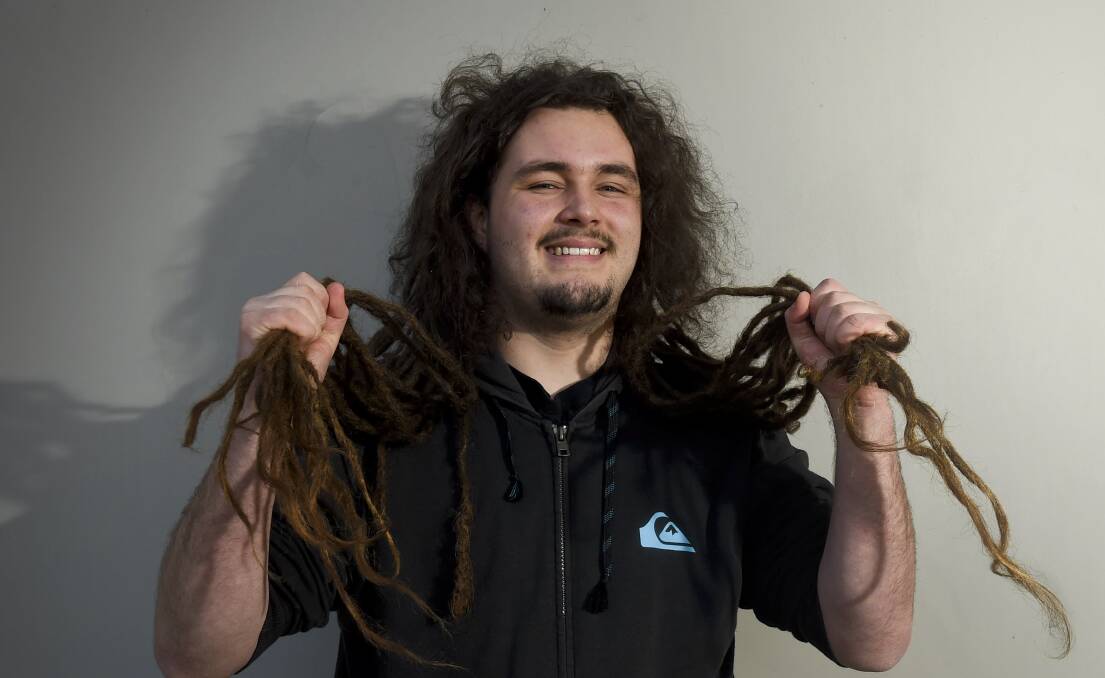 Jed Bloomfield has not had a haircut for 13 years but he's saying goodbye to his waist-length dreadlocks for the good cause of cancer research. Picture: NONI HYETT 
