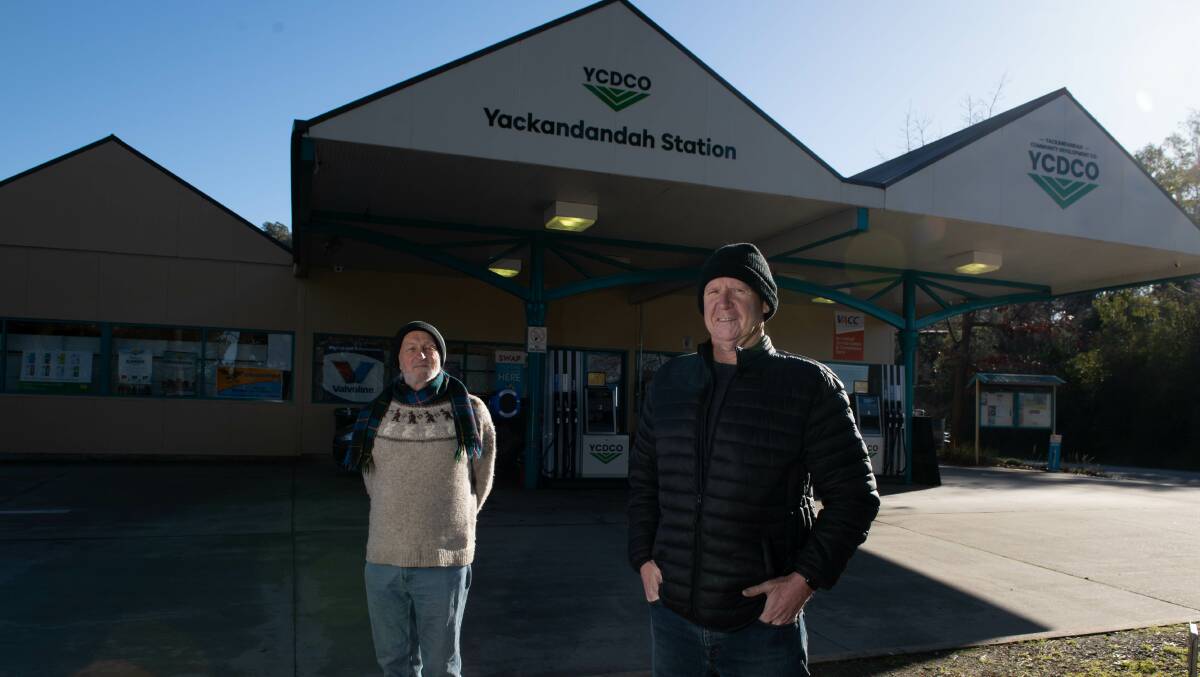 Rex Little, left, and Ian Fitzpatrick of the Yackandandah Community Development Company in front of the Yackandandah service station. Picture by Tara Trewhella