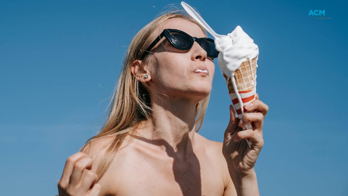 Ice-cream melts from the cone in hot sun. File picture