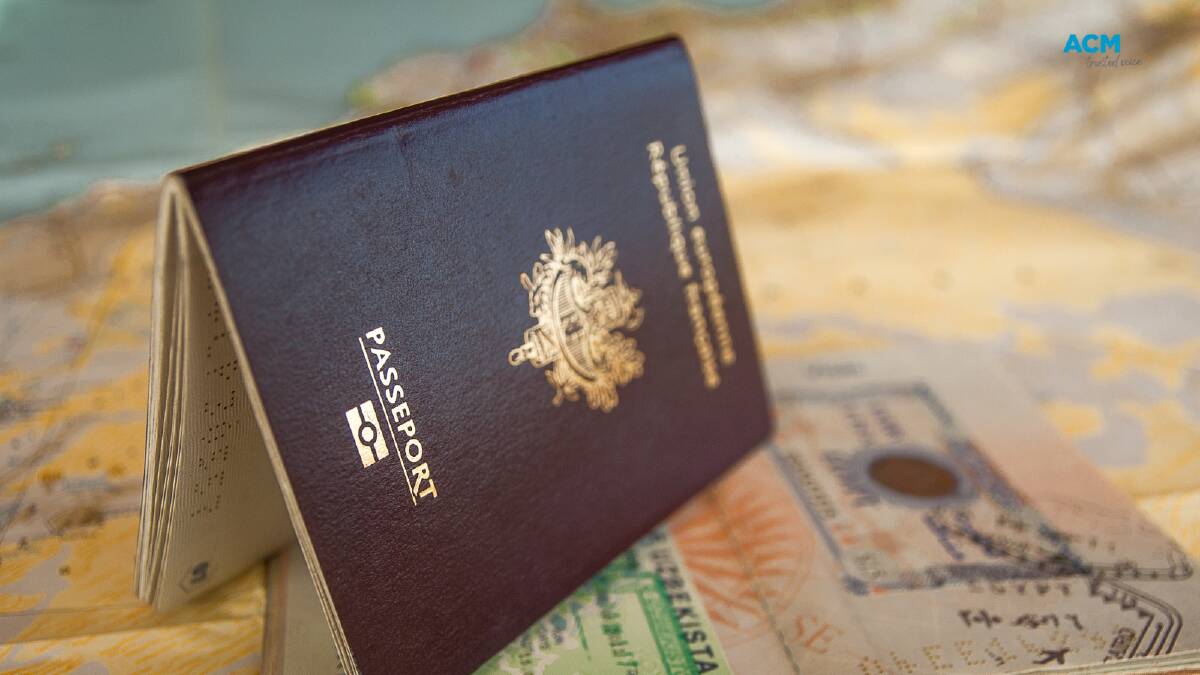 A foreign passport and cash. Picture via Canva