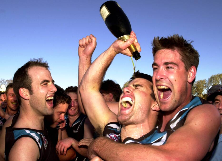 Belconnen players pop Champagne after a win. File picture