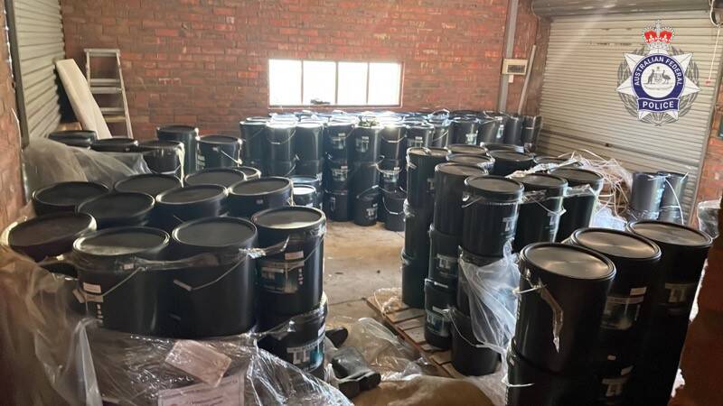 Buckets of liquid cement seized by AFP. Picture via AFP