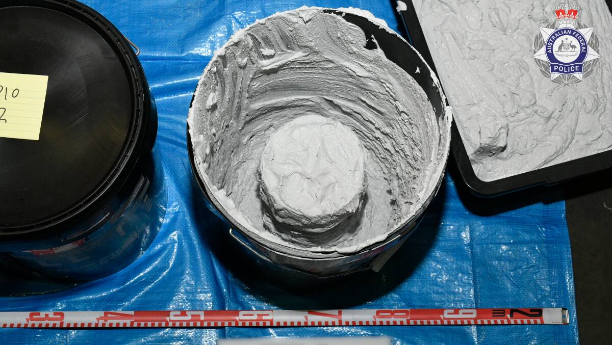Plastic tubes of ketamine allegedly found inside buckets of liquid cement. Picture via AFP