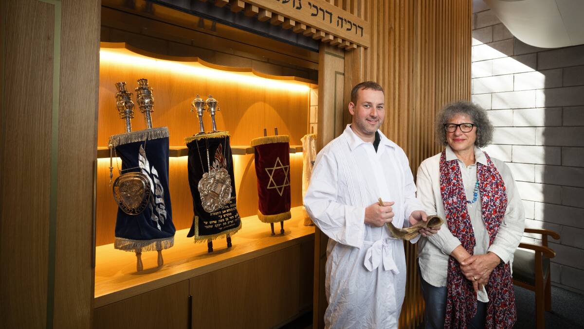 Rabbi Elhanan Miller and president of the ACT Jewish Community Karen Tatz in front of the ark in the orthodox synagogue. Picture by Sitthixay Ditthavong