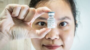 Professional services Pharmacist Yuh-Lin Gan of Kingston Capital chemist with the new Omicron XBB vaccine. Picture by Karleen Minney