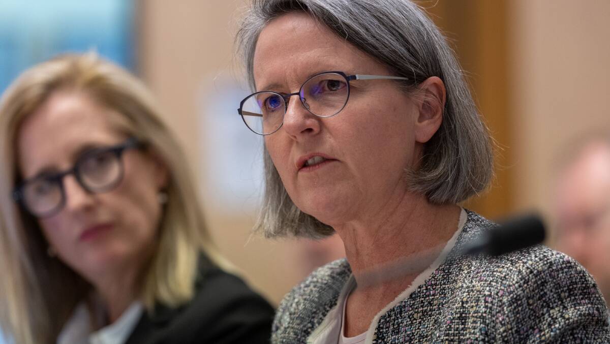 Finance Department secretary Jenny Wilkinson with Finance Minister Katy Gallagher talks about the PwC breach to a Senate Estimates hearing on Thursday.
Picture by Gary Ramage