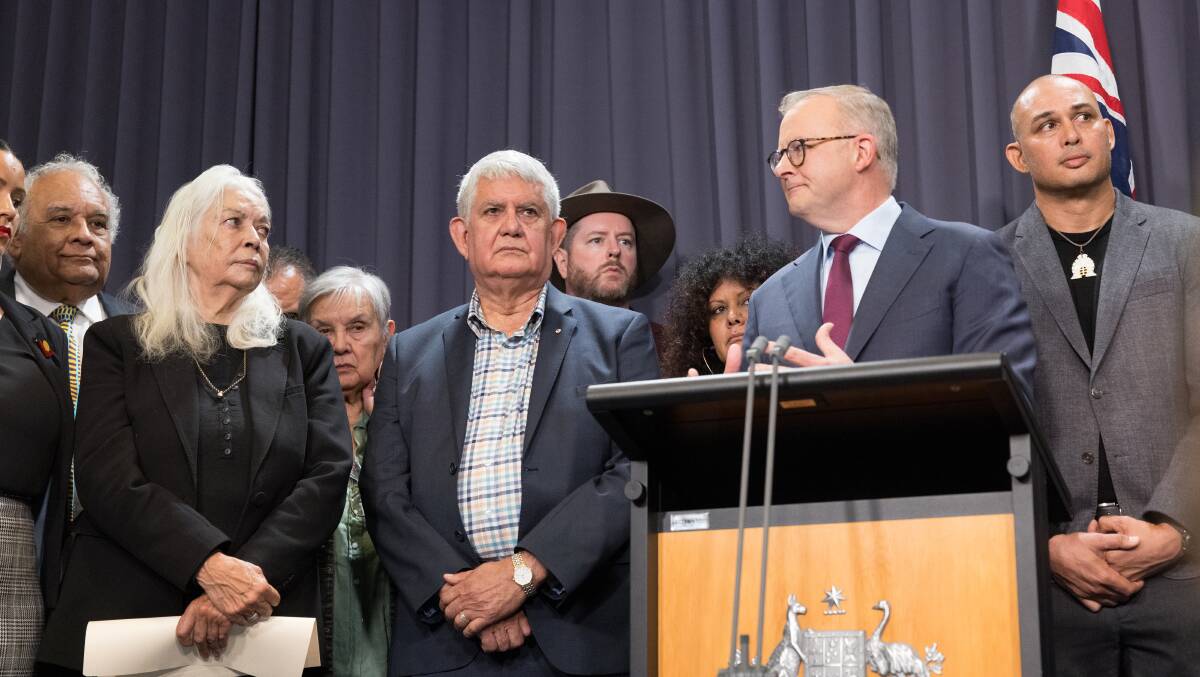 Marcia Langton and Ken Wyatt stand to the left of Prime Minister Anthony Albanese when he unveiled the draft constitutional amendments for the Voice to Parliament. Picture by Sitthixay Ditthavong
