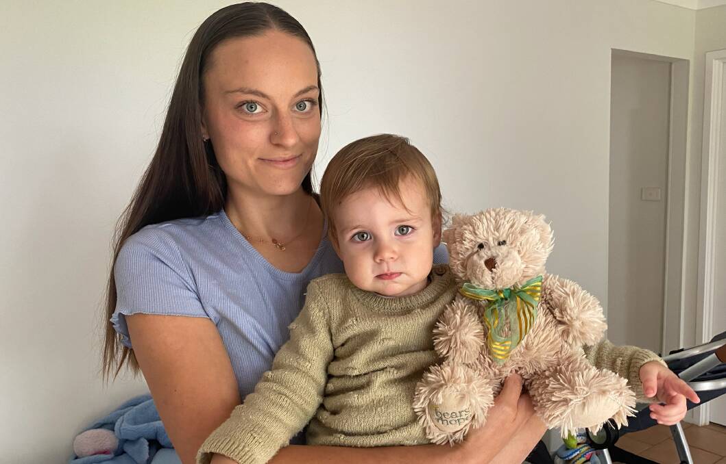 Samantha-Claire Randall and 18-month-old son Rogan with the Bear of Hope they found beside Old Southern Road in Worrigee. Picture by Glenn Ellard.