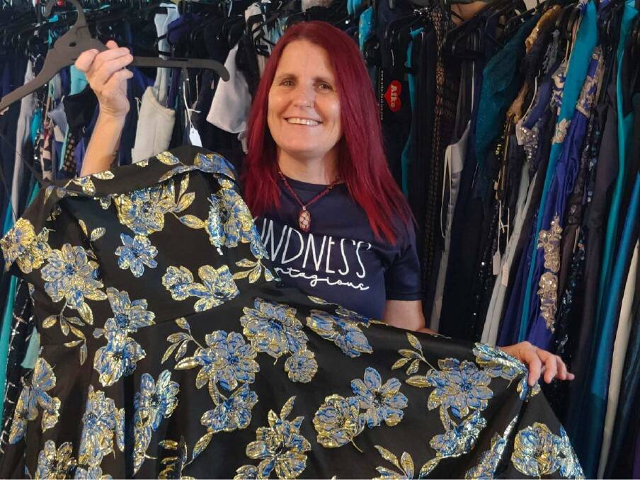 Founder of Formally Ever After,Tammy Robinson shows one of the hundreds of formal dresses she has amassed. Picture supplied. 