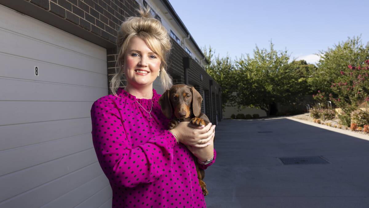 Tuggeranong resident Jess DeBlock and her miniature dashhound Daisy chose to stay in the region after moving out of home. Picture by Keegan Carroll