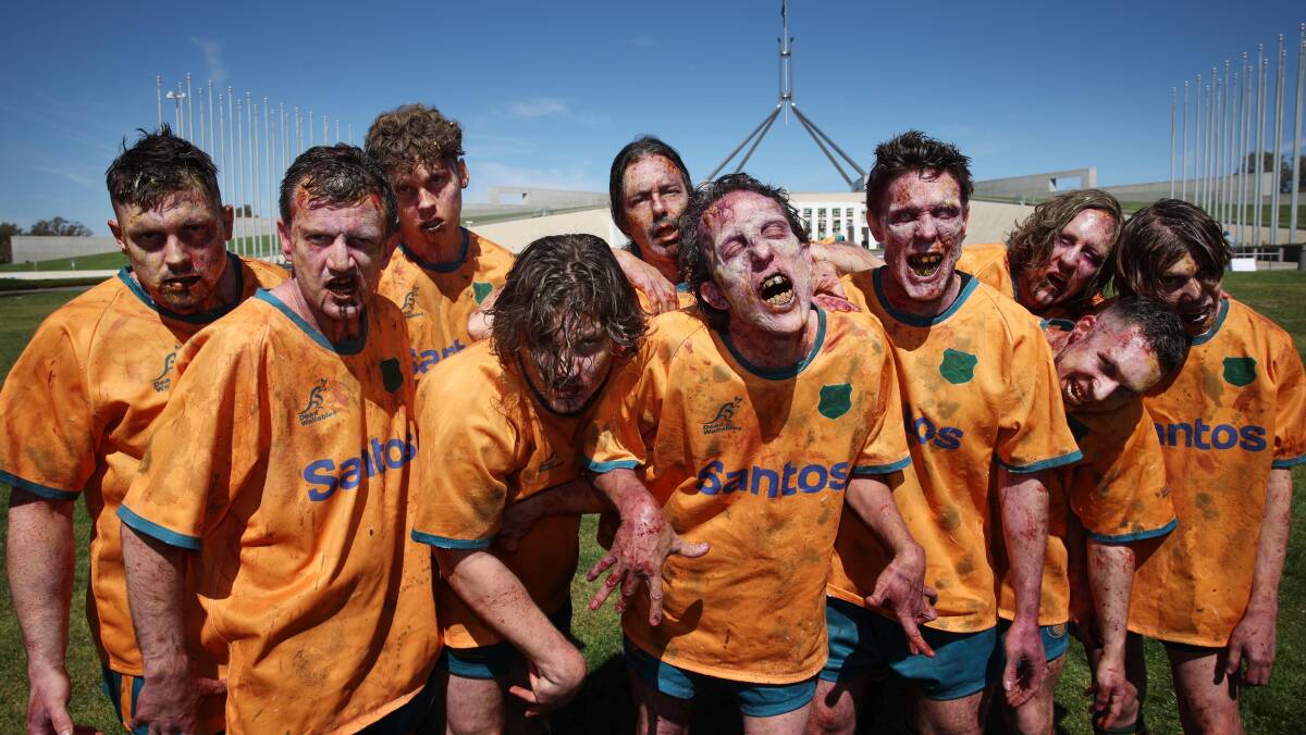 A group dressed as zombie Wallaby rugby players take part in protest in front of Parliament House. Picture by Gary Ramage