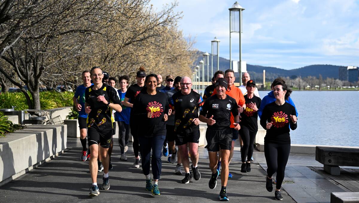 Rob de Castella, Andrew Leigh, Nova Peris and Pat Farmer go for a run around Lake Burley-Griffin. Picture AAP