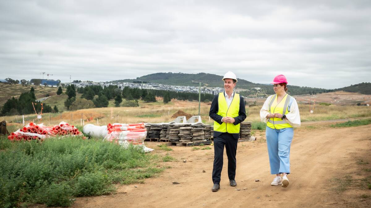 Planning Minister Chris Steel and City Services Minister Tara Cheyne survey the area after announcing construction has started on Molonglo River bridge. Picture by Karleen Minney