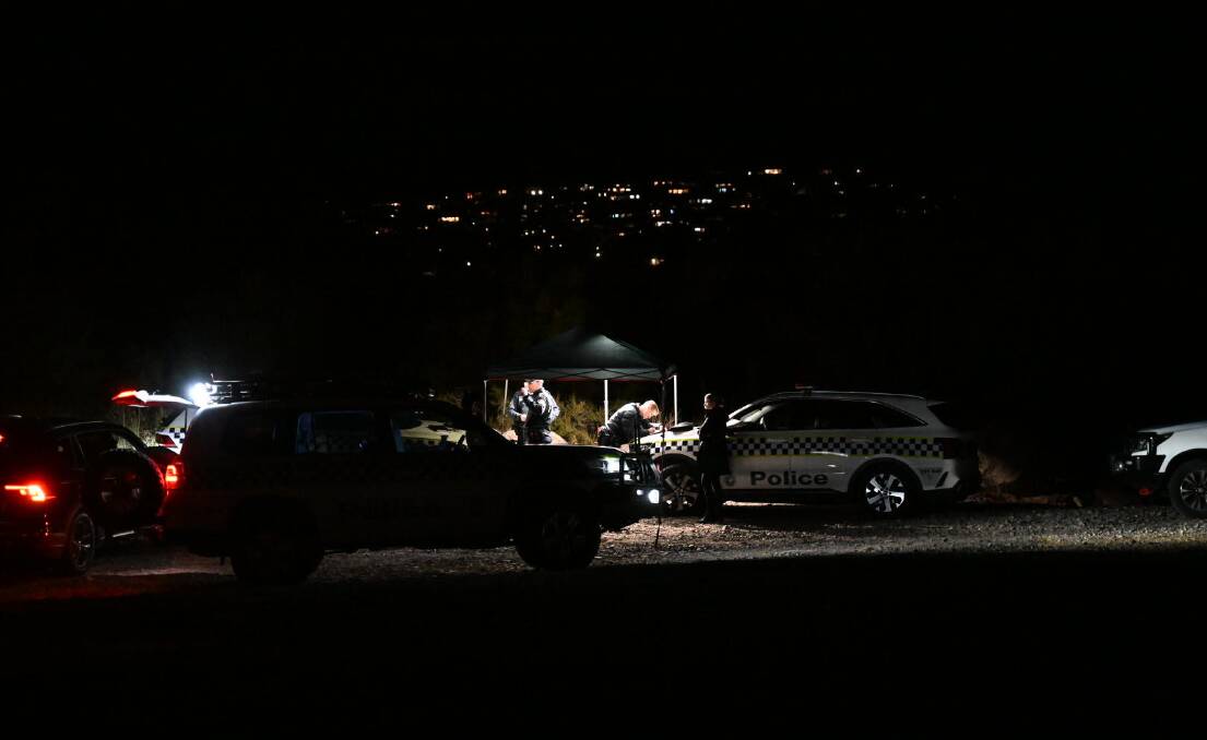 The scene of the investigation at Point Hut Crossing as darkness fell on Sunday. Picture by Elesa Kurtz