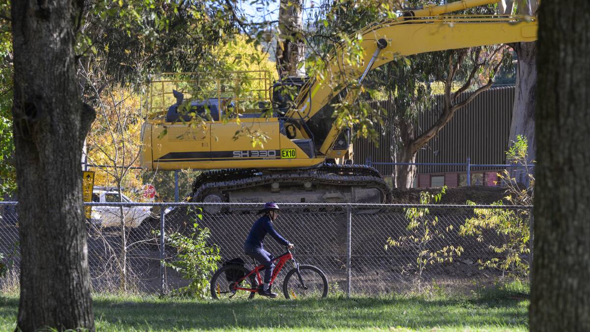 A cyclist riding past the construction works in O'Connor. Picture by Keegan Carrol.