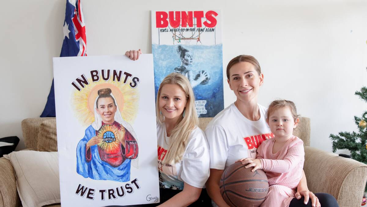Emma Groves with Canberra Capitals player Alex Bunton and Alex's daughter Opal-Mae. Picture: Sitthixay Ditthavong