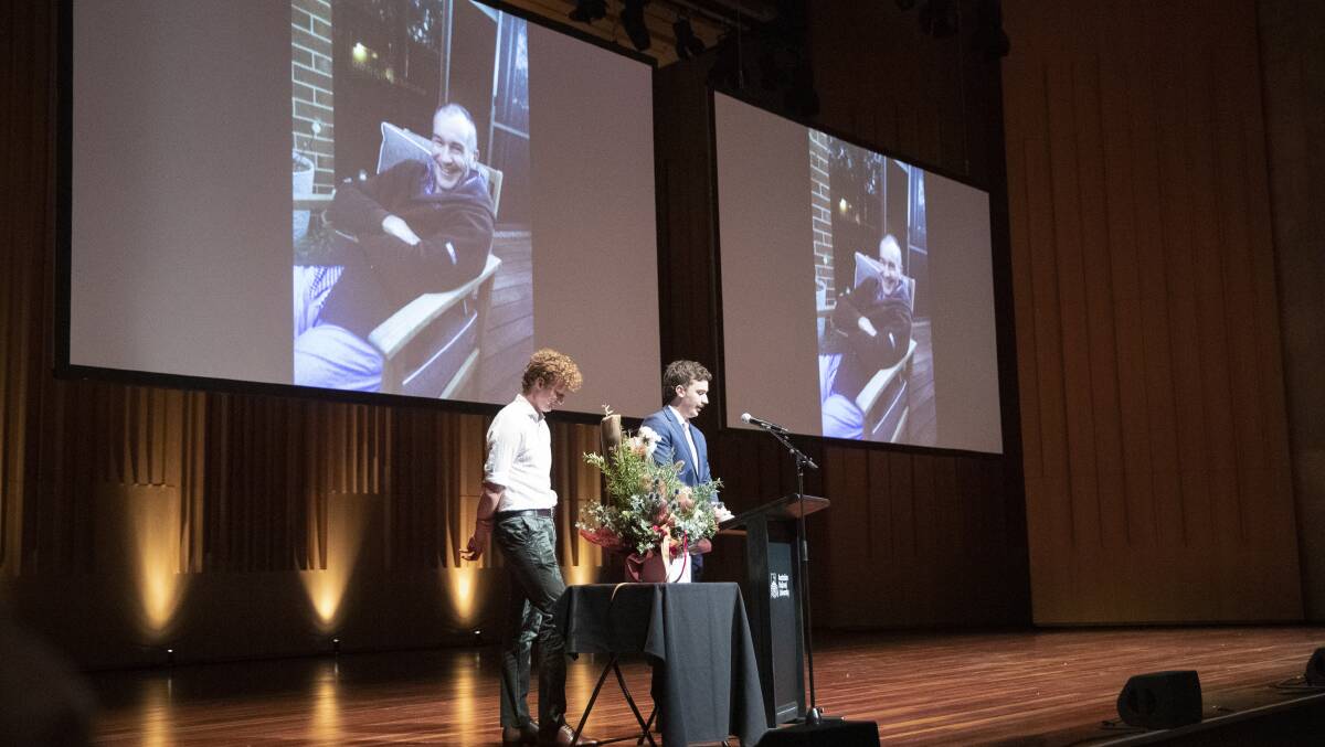 Dr Peter Scott's sons Hamish (left) and Tim Scott address his public memorial at the Llewellyn Hall on Sunday. Picture: Keegan Carroll