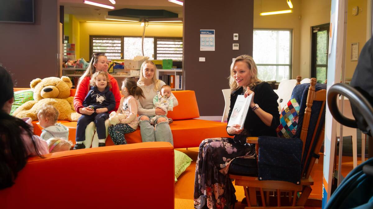 Canberra College Cares celebrating International Literacy Day with author, Shelley Unwin, reading her book Hello Baby to the mums and bubs. Picture by Elesa Kurtz