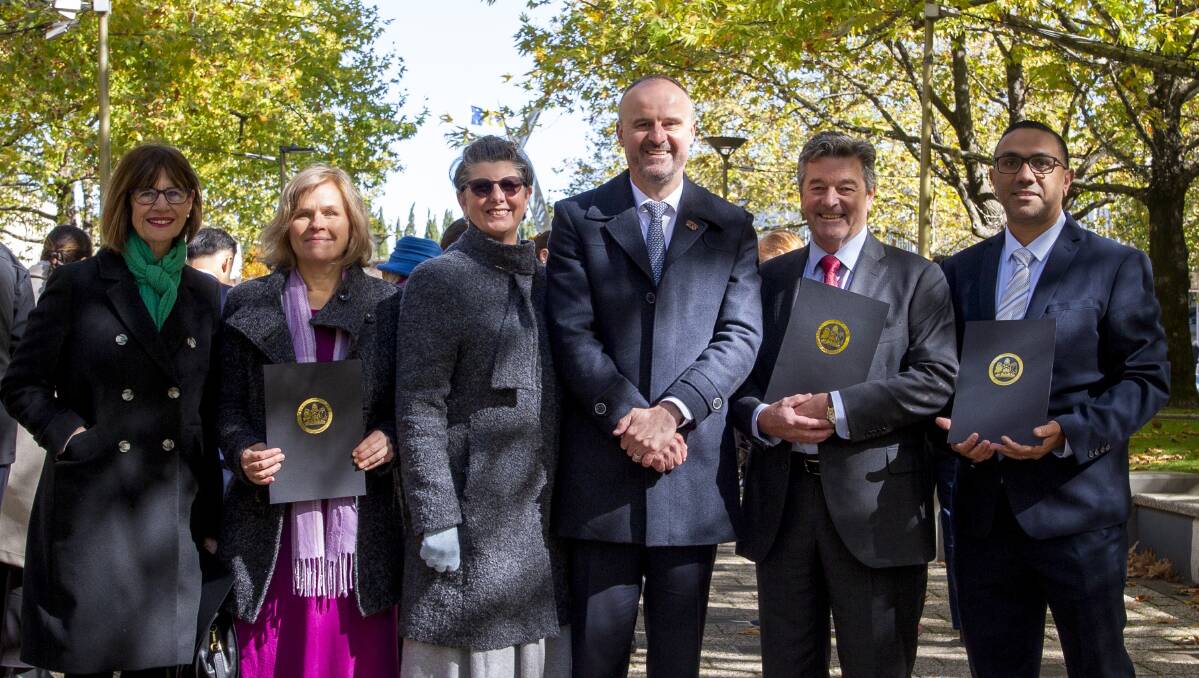 Maria Hawke (for her late husband Dr Allan Hawke), Kathy Ragless (for Companion House), Sue Gore-Phillips (for her late father Professor Mike Gore), Chief Minister Andrew Barr, Peter Cursley, and Graeme Brown (for his late mother Olive Brown) at the presentation. Picture supplied
