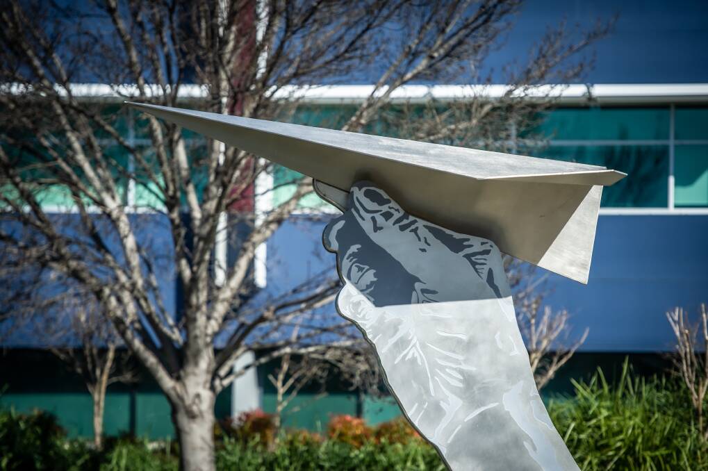  The paper plane artwork is next door to the airport.