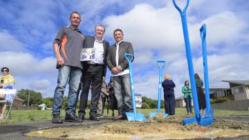 Yvonne Cuschieri's sons Roger and Todd with Respite Care for Queanbeyan chair Paul Walshe, centre, at the sod-turning on Friday. Picture by Keegan Carroll