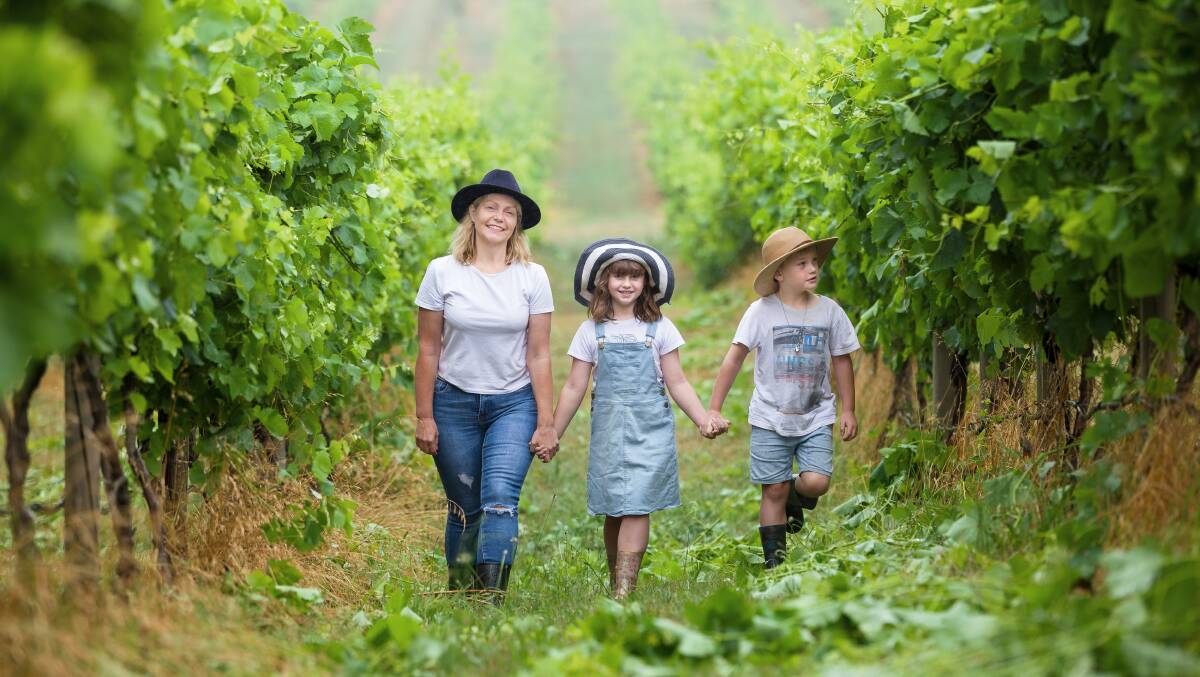 Lake George Winery owner Sarah McDougall with children Eloise and Ryder. Picture by Sitthixay Ditthavong