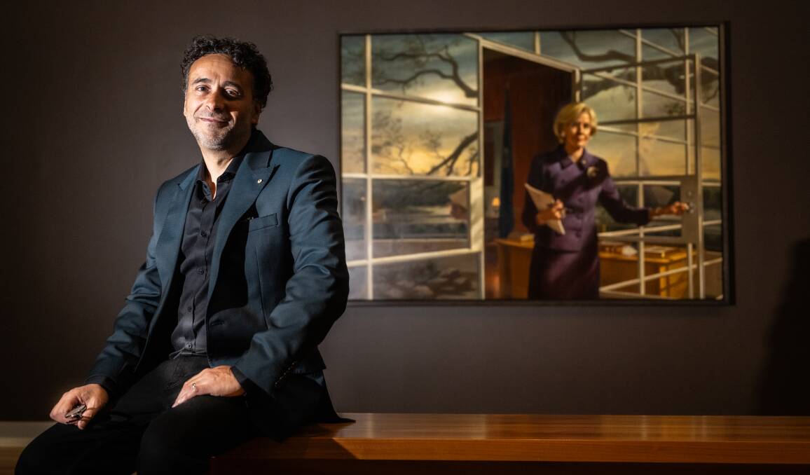 Ralph Heimans at the National Portrait Gallery on Thursday with one of the paintings in his new exhibition, of then Governor-General Quinten Bryce. Picture by Karleen Minney