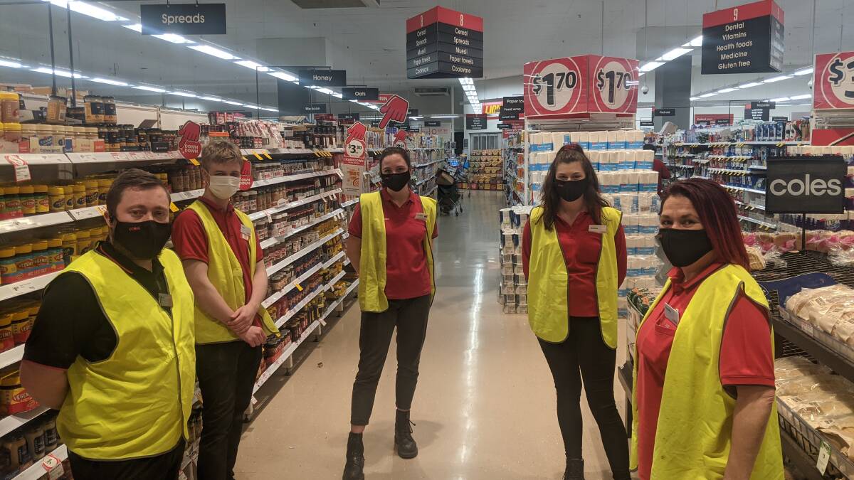 Coles Tuggeranong store manager Beau king with staff Alex Goldsworthy, Charlotte Luff, Jemma King and Natallie Williamson. Picture: Megan Doherty