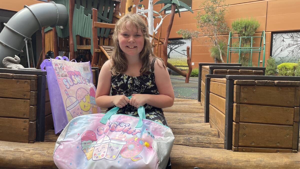 Abbey Rawson, 9, of Jervis Bay, received her showbag before going into surgery at the Canberra Hospital. Picture by Megan Doherty