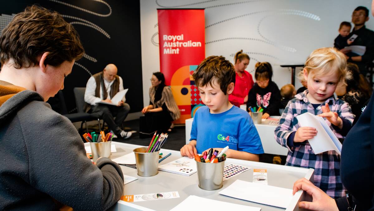Queanbeyan siblings Ziyad, 11, Yazid, 7, and Niya, 3, El-Aasar were lucky to hear the creators read Diary of a Wombat and then do some craft at the Mint. Picture: Elesa Kurtz