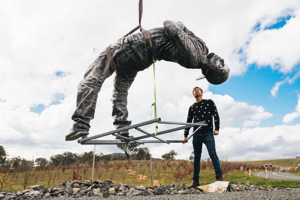 Artist Louis Pratt at the installation of his work A Backwards Attitude at the arboretum in 2017. Picture: Rohan Thomson