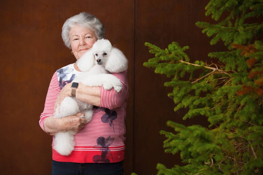 Bev Nicholson, of Greenway, with her beloved toy poodle Pebbles. Picture by Sitthixay Ditthavong