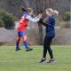 Coach Eugenie Hickey and player Alyssa Keeffe celebrate a goal in a photograph that has gone viral. Picture: Luke Hickey