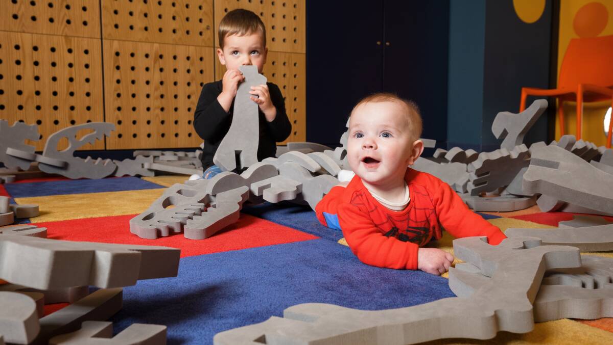 Buddies Emmett Konrad, 2, of Casey, and Jonah Robertson-Millar, 4 months, of Kambah, playing at the centre. Picture by Sitthixay Ditthavong