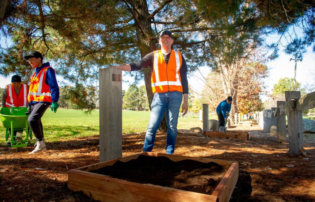Salesforce staff member David Parkes with some of the garden beds that were built for Floriade bulbs in the Memorial Grove. Picture: Elesa Kurtz