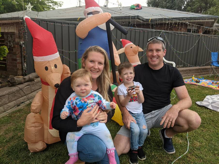 Katie and Andrew Luton with their children Tessa, 10 months, and Charlie, 4, at their home in Burraly Court hosting a neighbourhood barbie before hte lights went on. Picture: Megan Doherty
