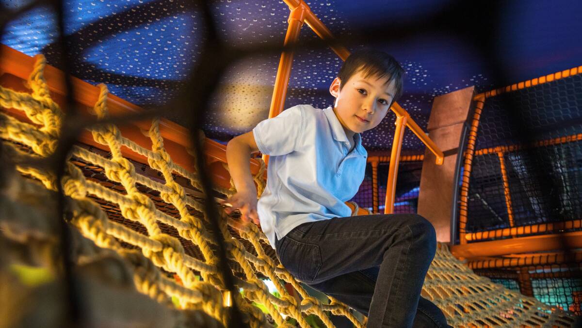 Six-year-old David Siu on the climbing frame. Picture by Sitthixay Ditthavong
