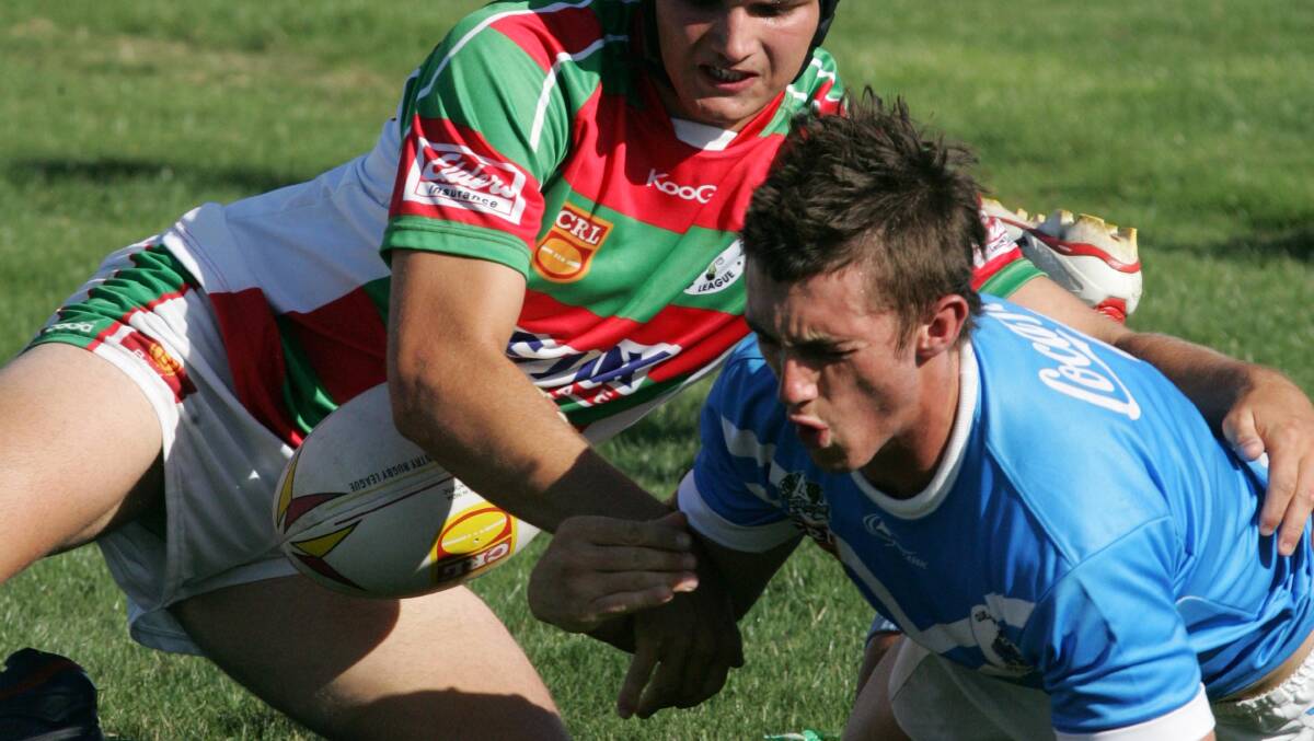 Joe Bobbin (right) playing local footy. Picture by The Canberra Times 
