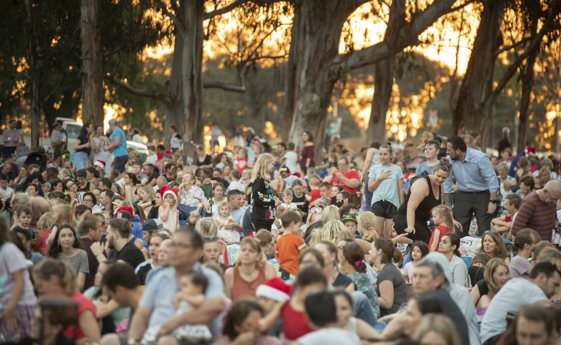 The crowd enjoying the Carols by Candlelight at Stage 88 in 2018. Picture by Sitthixay Ditthavong