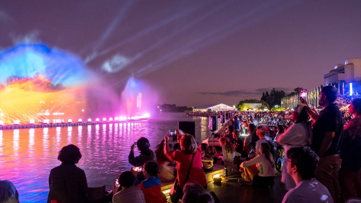 The crowd flowed right down to the edge of Lake Burley Griffin to take in the show. Picture by Dom Northcott