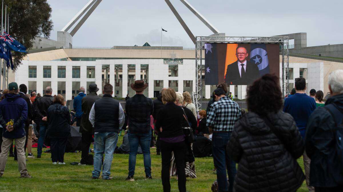 The crowd watches Prime Minister Anthony Albanese address the national memorial service for the Queen. Picture by Elesa Kurtz