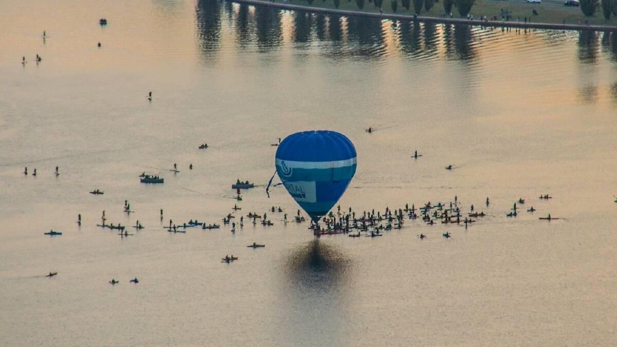 The old balloon skims Lake Burley Griffin. Picture: Paul Jurak