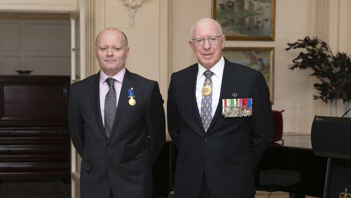 Canberra obstetrician Dr David O'Rourke (left) at Government House on Wednesday with Governor-General David Hurley. Picture: Keegan Carroll