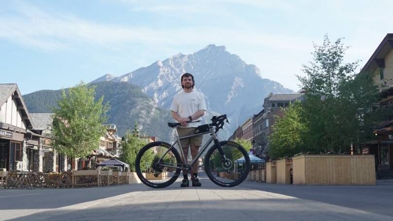Canberran Jack Keogh on Friday sent this photograph of him on the main street of Banff with his bike safe and sound back with him. Picture supplied