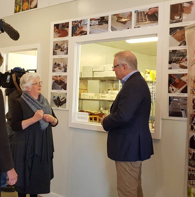 Robyn Rowe this week in her chocolate shop with the Prime Minister Scott Morrison. Picture: Supplied