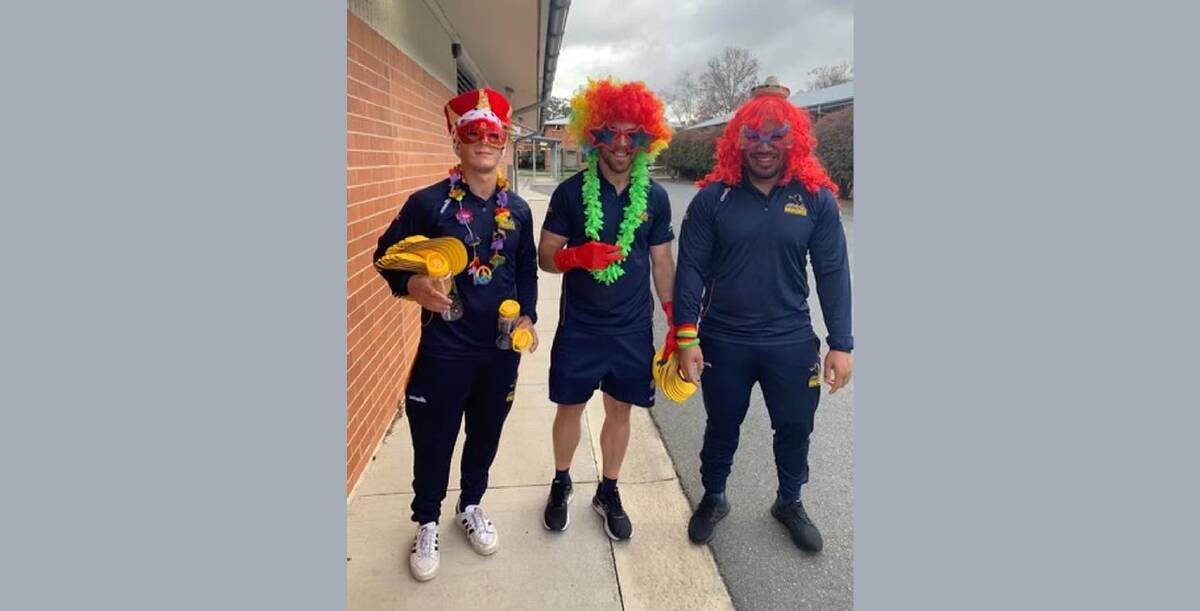 Brumbies players Nathan Carroll, Hudson Creighton and Fred Kaihea got into the spirit of the day at Queanbeyan South. Picture: Supplied