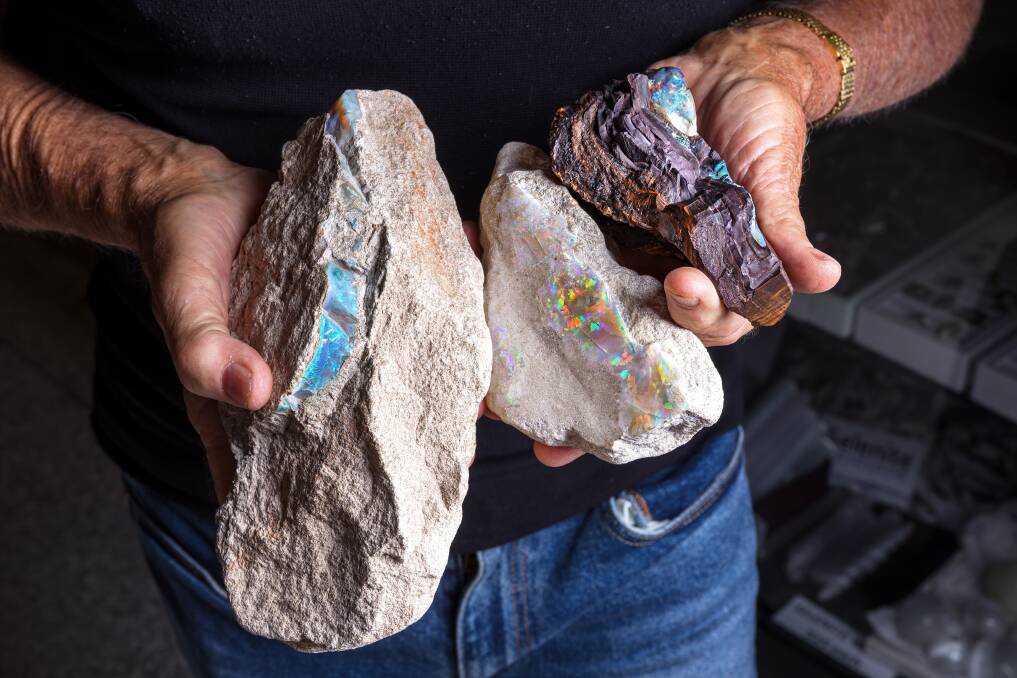 Peter Blythe with some of the opals he has found. Picture by Sitthixay Ditthavong