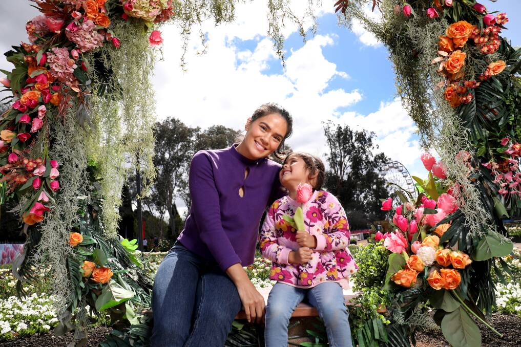 Janette Wojtaszak and daughter Luna, 4, (above) got a sneak peek at Floriade on Friday. Picture by James Croucher